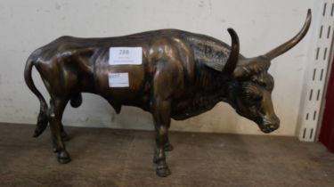 A bronze figure of a longhorn bull