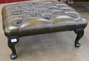 A green leather Chesterfield stool