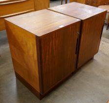 A pair of teak cabinets