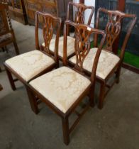 A set of four Chippendale Revival mahogany dining chairs