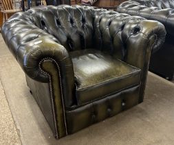 A green leather Chesterfield club chair