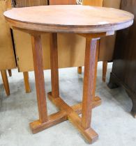 A Cotswold School oak circular table