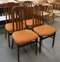 A set of four teak dining chairs