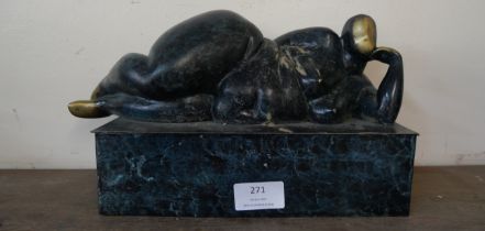 A Surrealist style bronze figure of a reclining female