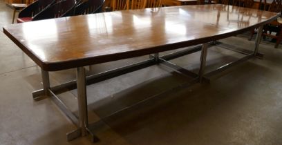 A large teak and chrome dining table (351 x 139cms)