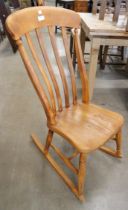 A Victorian elm and beech rocking chair