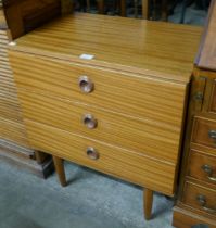 A small teak chest of drawers