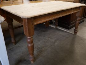 A Victorian style pine kitchen table