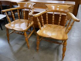 A pair of Victorian style beech smokers bow chairs