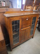 An early 20th Century oak side by side bookcase