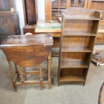 An oak barleytwist gateleg table and an oak open bookcase