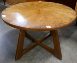 A teak and walnut circular coffee table