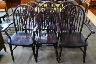 A set of six beech wheelback kitchen chairs