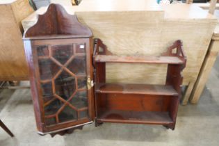 A mahogany wall hanging corner cabinet and hanging shelves