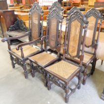 A set of six Carolean style carved oak dining chairs with cane upholstery
