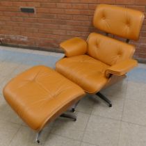 A Charles & Ray Eames style simulated rosewood and tan leather revolving lounge chair and ottoman