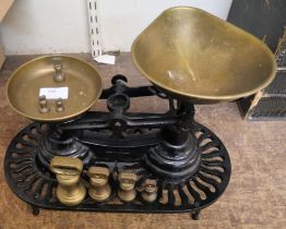 A set of kitchen scales and weights and a cast iron trivet