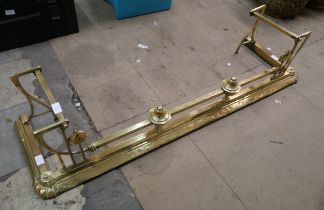 A Victorian brass fender