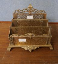 A pierced brass three compartment letter rack