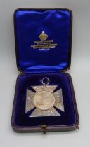 A silver medallion with inscription dated 1901, St. Georges College, Eastbourne, cased, 16g