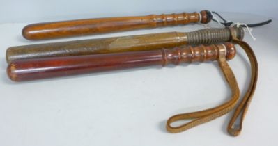 Three wooden truncheons