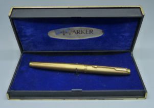 A gold plated Parker fountain pen with a 14ct gold nib, boxed