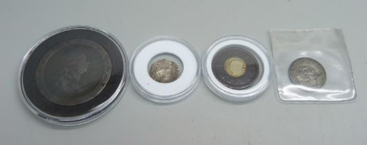 Four coins; a George III cartwheel penny, a Victorian penny model, a German 1825 3 Kreuzers coin and