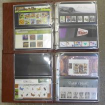 Great Britain; 2004-2011 commemorative presentation packs in two special Post Office albums, 110+