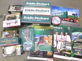 A collection of Eddie Stobart items, boxed lorries, calendar, etc.