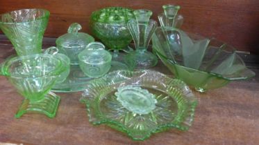 A collection of uranium glass including a flower frog, dressing table set, vases, etc. **PLEASE NOTE