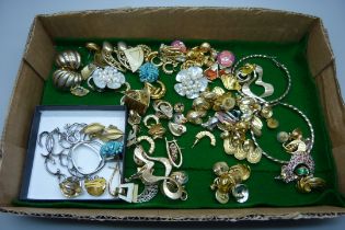 Approximately fifty pairs of costume earrings including Trifari and Fossil