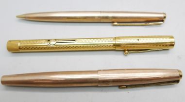 Three gold plated pens, two Parker and a Waterman