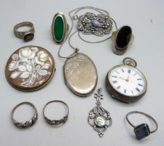 A silver locket and chain, six silver rings, etc., and a 935 silver fob watch