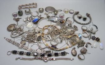 A large collection of silver jewellery, rings, chains, pendants, lockets, etc., a 19th Century