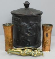 A cast iron tobacco jar, a Punch and Judy nutcracker and two pieces of trench art