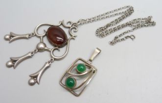 A large 800 silver pendant on a 925 silver chain and an 835 silver and green stone pendant