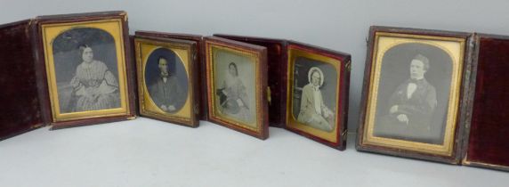 Five daguerreotype photographs in folding frames