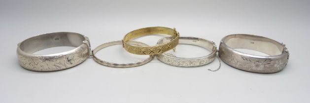 Five silver bangles, 110g, (two dented)