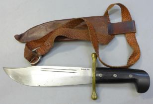 A WWII US Bowie knife, the blade marked Case XX, in original sheath