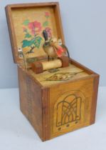 A Japanese 'surprise' wooden and painted cigarette box