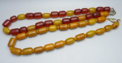 Two amber coloured bead necklaces