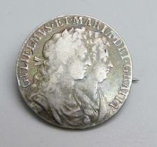 A William and Mary 1689 half-crown, made into a brooch