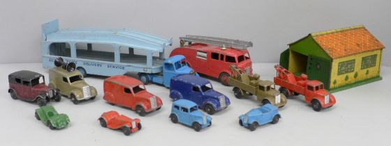 A collection of vintage Dinky Toys die-cast model vehicles and Meccano tin plate garage