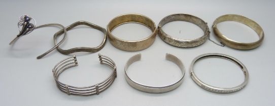 Six silver bangles, 107g, and two other bangles