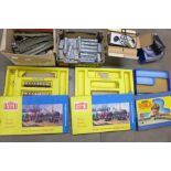 Model rail, track, two power units, carriages, a box with two carriages, two empty boxes, a