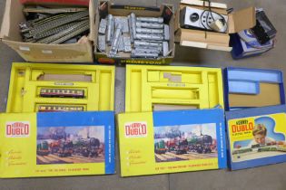 Model rail, track, two power units, carriages, a box with two carriages, two empty boxes, a