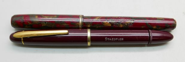 A Waterman marbled fountain pen and a Staedtler bottom filler fountain pen