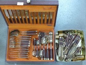 A bronze and rosewood cutlery set, 101 pieces **PLEASE NOTE THIS LOT IS NOT ELIGIBLE FOR POSTING AND