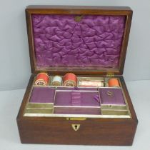 A wooden sewing box with mother of pearl inlay