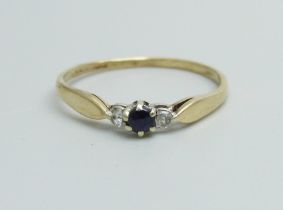 A 9ct gold, sapphire and diamond three stone ring, 0.8g, O